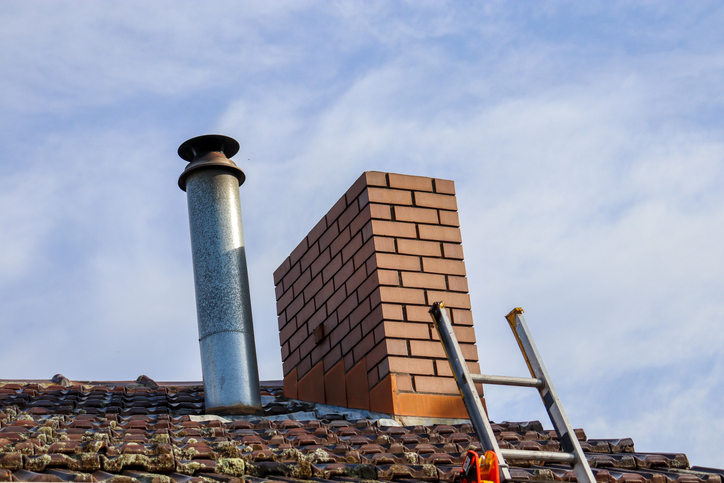Chimney repaired with lead and sealer installed around the edges