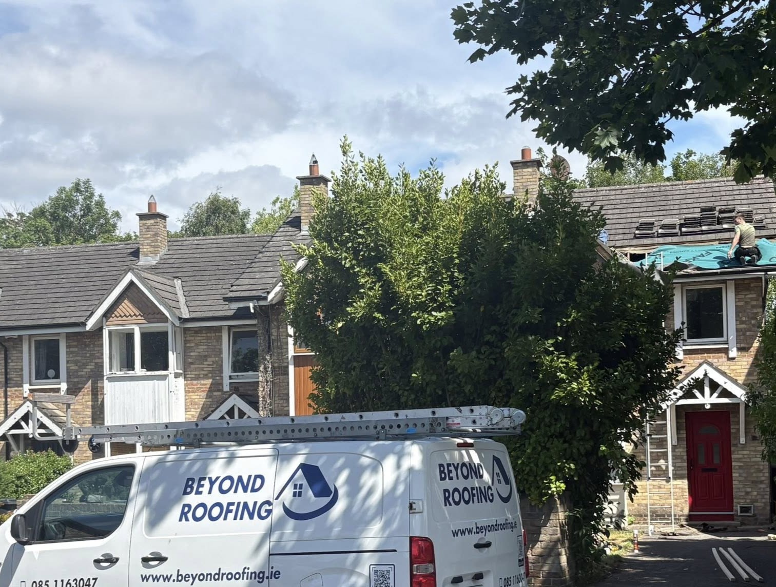 side view of an extension at the back of a house with the dry verge system and roof tiles visible.